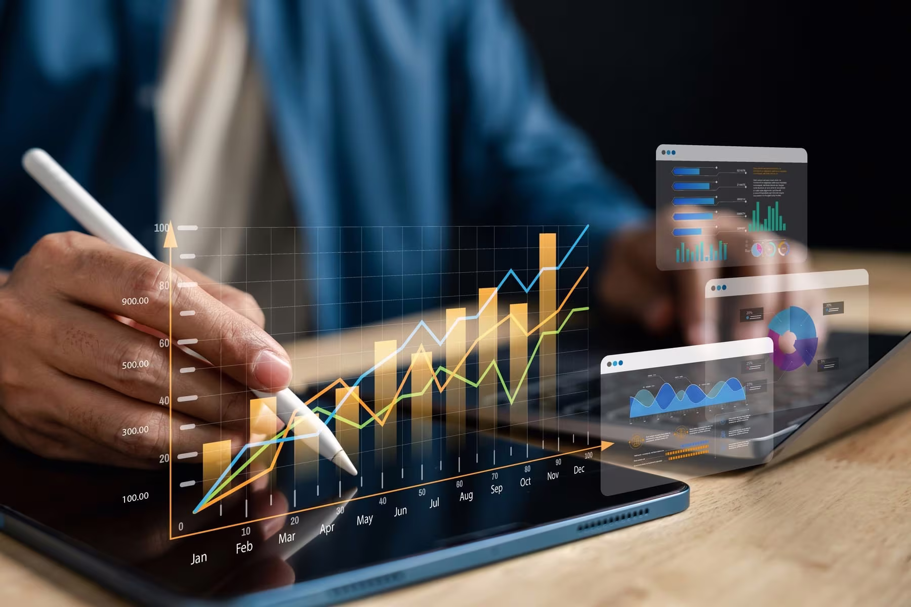 Business growth charts on a tablet with a stylus